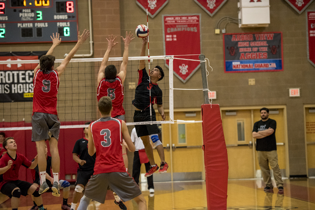 Raymond Magante (3) of Las Vegas spikes the ball against Arbor View at Arbor View High Schoo ...