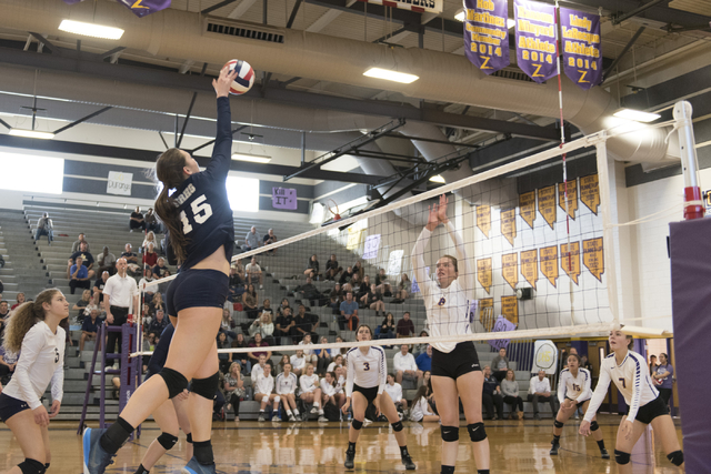 Shadow Ridge’s Whittnee Nihipali (15), left, hits the ball against Durango during a Su ...