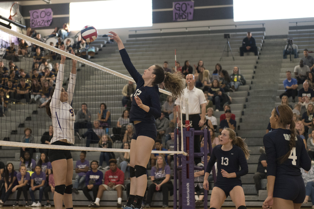 Shadow Ridge’s Rachel Chambers (12), second from left, hits the ball against Durango d ...