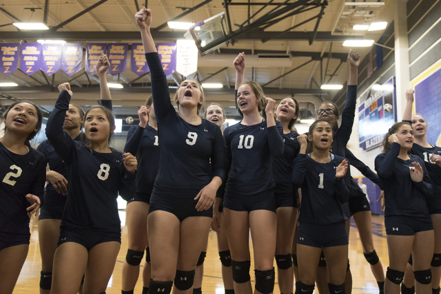 Shadow Ridge players celebrate a victory against Durango during a Sunset Region girls volley ...
