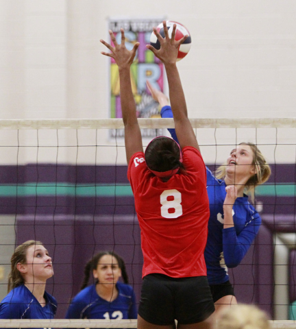 Las Vegas Tajanae Davis leaps to block as Basic Kali Wieres gets ready to spike the ball dur ...