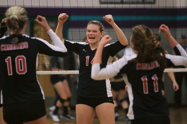 Coronado’s Cali Thompson, center, and teammates celebrate winning a point during their ...