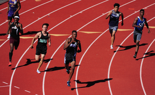 Silverado runner Zakee Washington, center, races to a winning time of 48.64 seconds in the 4 ...