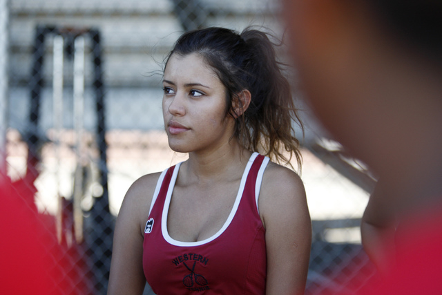 Western’s senior Nathalia Luna, 18, listens to her coach prior to her match against De ...