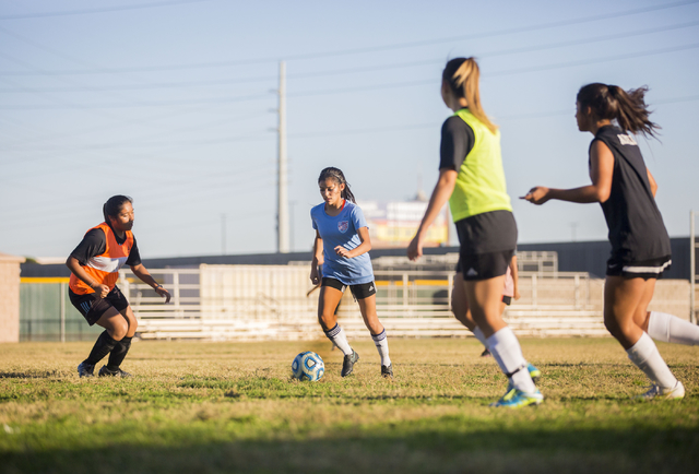 Western Warrior girls soccer midfielder and captain Kirsten Molinaruns, senior, second from ...