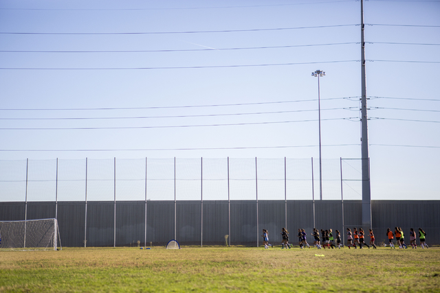 The Western Warriors girls soccer team run laps before practice at Western High School, Wedn ...