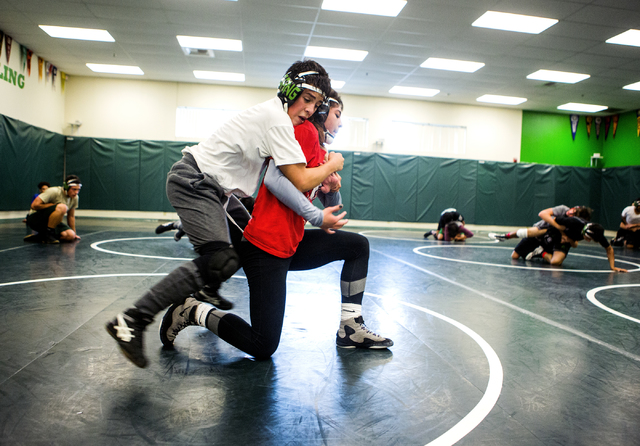 Leiana Nacapuy, in red, a Junior Women’s Freestyle Nationals All-American, goes throug ...