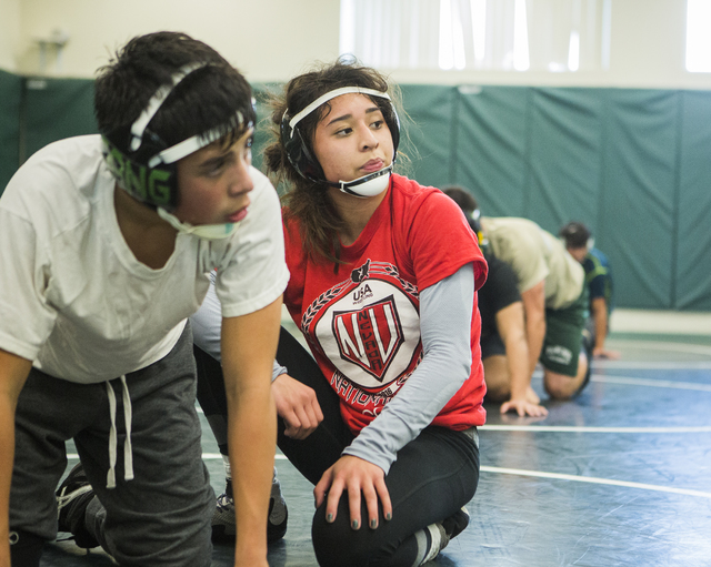Leiana Nacapuy, in red, a Junior Women’s Freestyle Nationals All-American, listens du ...
