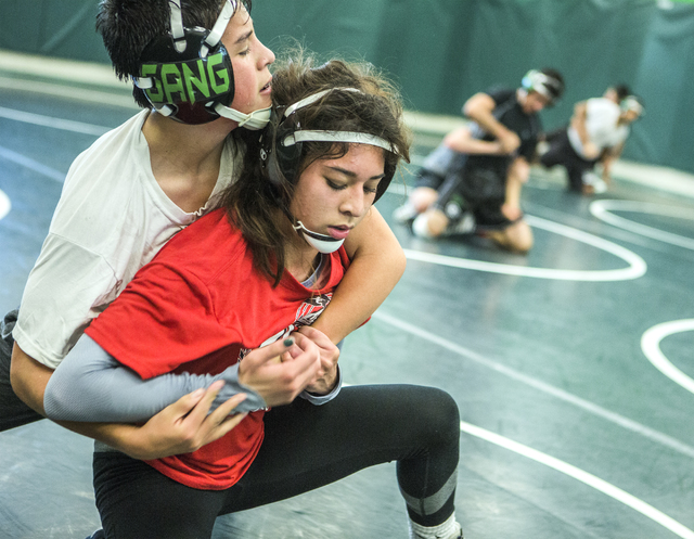Leiana Nacapuy, in red, a Junior Women’s Freestyle Nationals All-American, goes throug ...