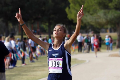 Foothill’s Karina Haymore raises her arms while crossing the finish line during the Su ...