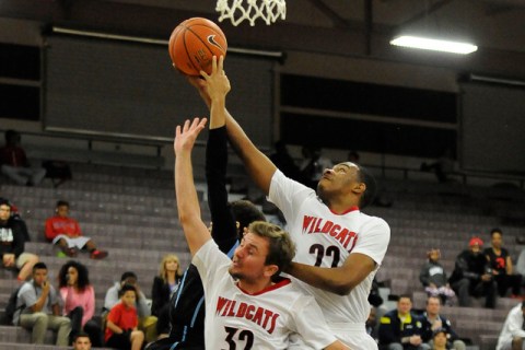 Las Vegas guards Patrick Savoy (22) and Trevor Swenson (32) defend Foothill guard Kevin Wood ...