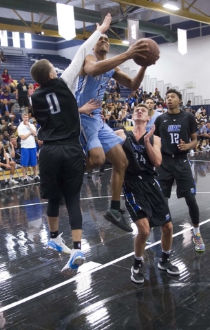 Team Howard Pulley shooting guard Gary Trent Jr., center, (1) goes up for shot against team ...