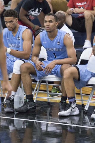 Team Howard Pulley shooting guard Gary Trent Jr., center, (1) is seen on the bench while pla ...