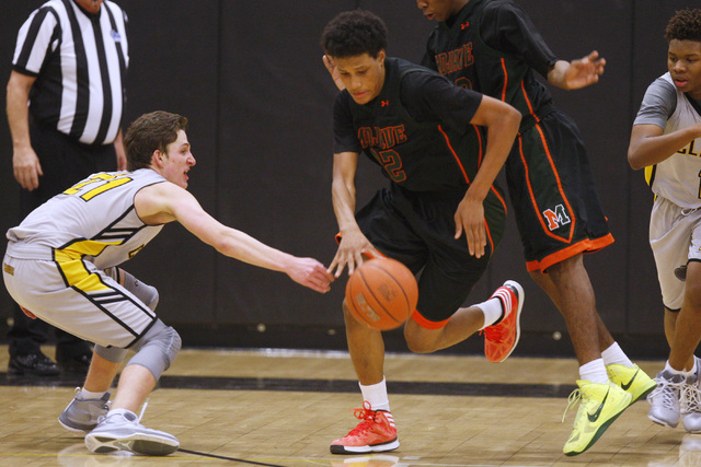 Mojave’s Chrishawn Thomas steals the ball from Clark guard Carter Olsen on Tuesday. Cl ...