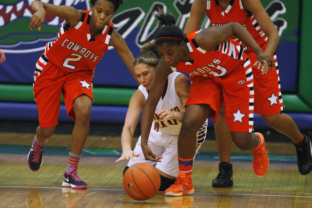 Chaparral guard Jasmine Martin, left, and Marcia Hawkins chase down a loose ball with Dimond ...