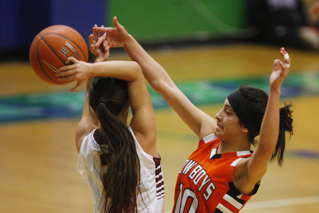 Chaparral guard Abigail Delgado swats the ball away from Dimond guard Tiffany Jackson during ...