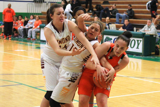 Dimond center Lexi Wingert, left, and guard Lauren Hines fight for a loose ball with Chaparr ...