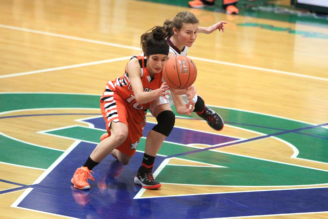 Chaparral guard Abigail Delgado and Dimond guard Nikki Forrey chase a loose ball during thei ...