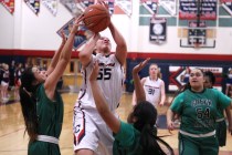 Coronado forward Kayla Watterson gets a shot off over Green Valley guards Gracelle Garcia, l ...