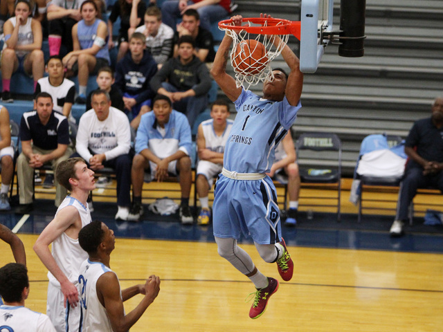Canyon Springs guard Jordan Davis dunks on Foothill during their game Tuesday, Feb. 17, 2015 ...