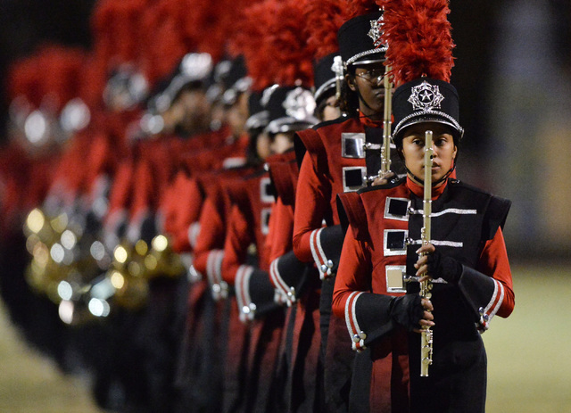 The Las Vegas High School band marches off the field before the Las Vegas High School Canyon ...