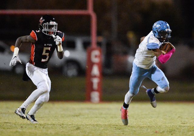 Canyon Springs running back Javion Pugh (22) runs the football during the Las Vegas High Sch ...