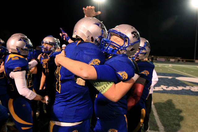 Pahranagat Valley players celebrate their 66-34 win over Spring Mountain during the Division ...