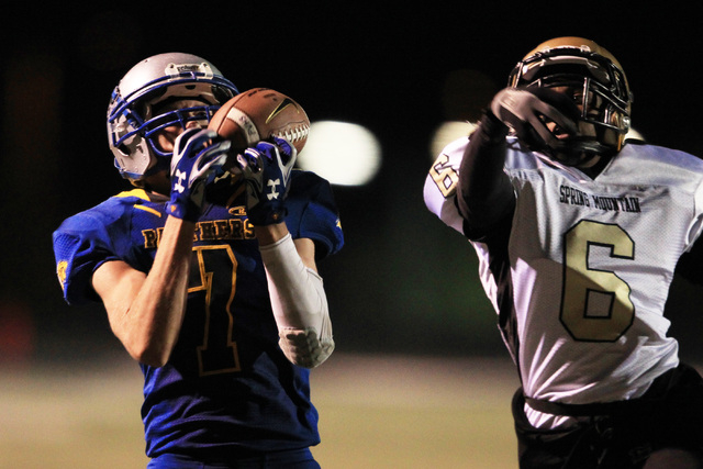 Pahranagat Valley tight end Shawn Wadsworth pulls in a touchdown pass while being covered by ...