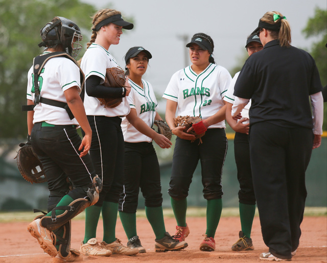Samantha Pochop (72), second from left, meets with her team in the pitchers circle during a ...
