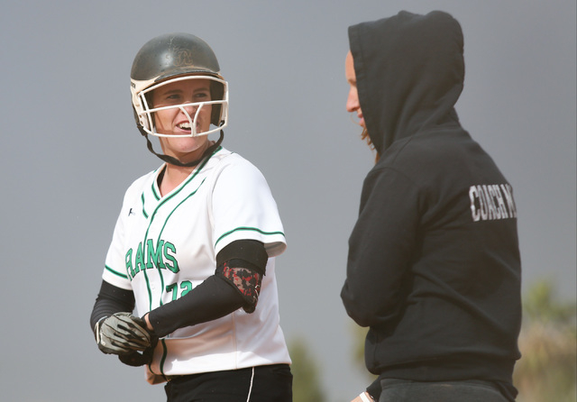 Samantha Pochop (72) cracks a smile after getting a base hit during a game between the Ranch ...