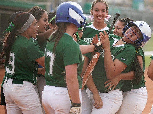 Green Valley’s Samantha Loving, far right, is swarmed by teammates after hitting a hom ...