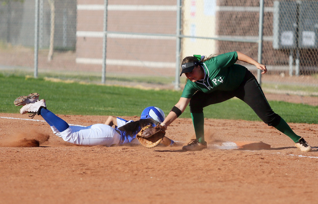 Green Valley senior Chelsea Perez, left, makes it back to first base safely past Palo Verde ...