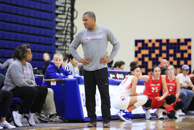 Bishop Gorman head coach Kevin Nixon, center, talks to an assistant during the Las Vegas Inv ...