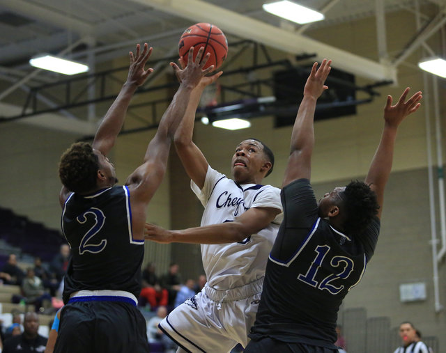 Cheyenne senior William Federson (20) shoots the ball during the Class 3A boys regional bask ...