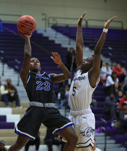 Desert Pines junior Donovan Word (23) shoots the ball during the Class 3A boys regional bask ...