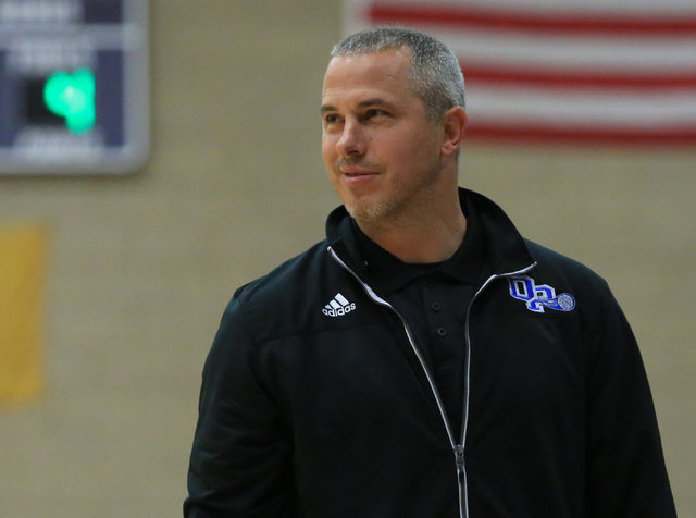 Desert Pines head coach Michael Uzan cracks a smile in the fourth quarter of the Class 3A bo ...