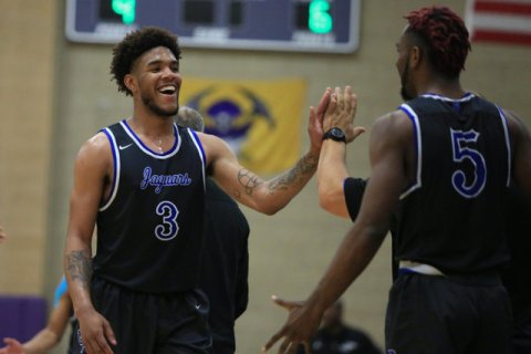 Desert Pines senior Trevon Abdullah (3) smiles as he is pulled off the court in the fourth q ...