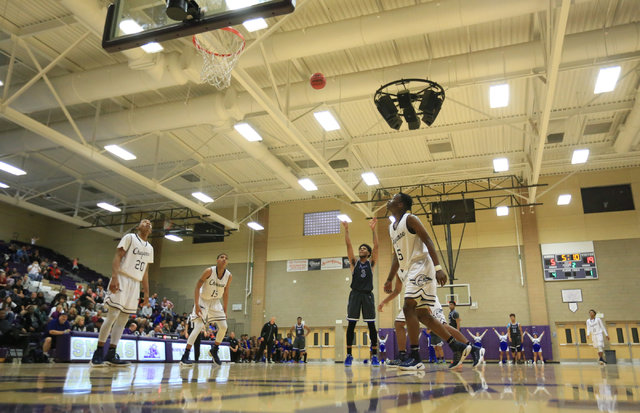 Desert Pines senior Trevon Abdullah (3) makes a free throw during the Class 3A boys regional ...