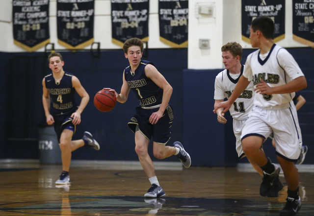 Rancho Solano’s Caden Hoffman (1) drives up courtduring a basketball game at Lake Mead ...
