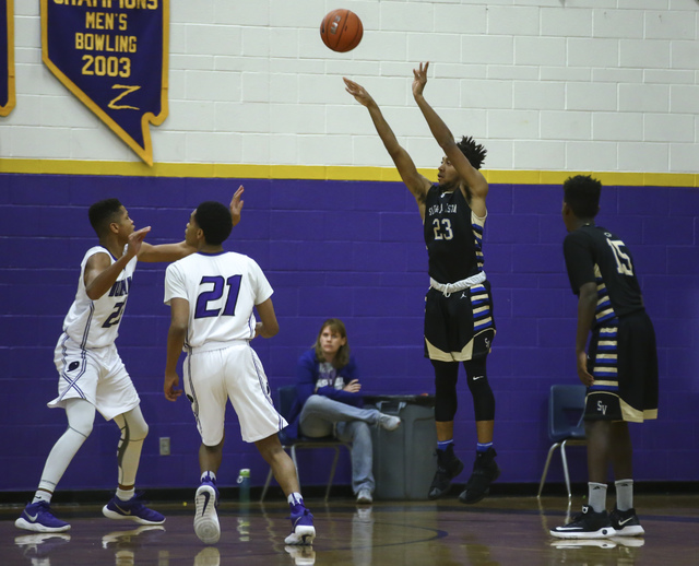 Sierra Vista forward Chris McCoy (23) shoots over Durango defense during a basketball game a ...