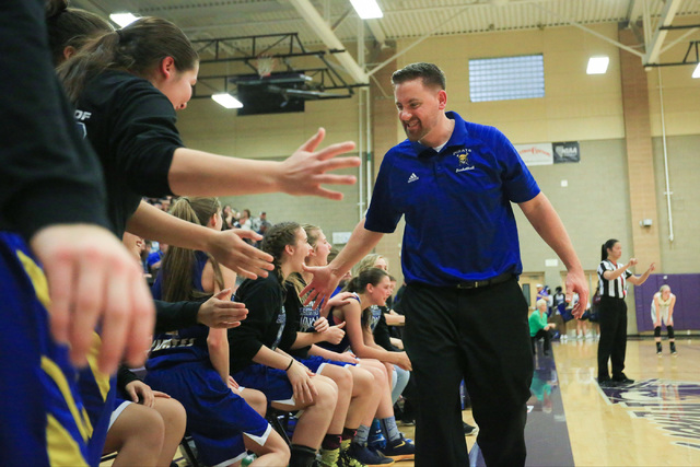 Moapa Valley head coach Stuart Humes high-fives his team before time runs out during the Cla ...