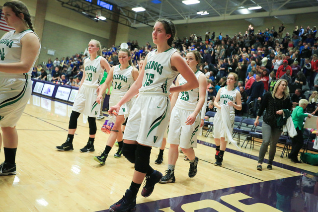 The Virgin Valley High School Bulldogs walk off the court after loosing to Moapa Valley High ...