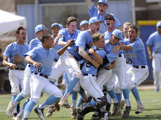 Centennial players celebrate after defeating Bishop Gorman 3-1 in the Sunset Region champion ...