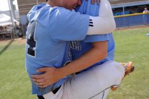 Centennial’s Jake Portaro, left, and Will Loucks embrace after the Bulldogs defeated B ...