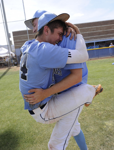 Centennial’s Jake Portaro, left, and Will Loucks embrace after the Bulldogs defeated B ...