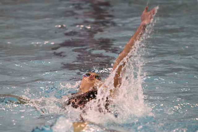 Abby Richter competes in the girls 100-yard backstroke during the Sunrise and Sunset Region ...