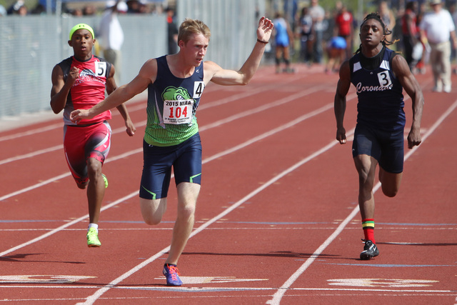 Green Valley sprinter Ian Mack wins the 100-meter dash during the Sunrise and Sunset Region ...