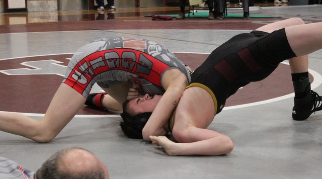 Arbor View 106-pounder Peyton Prussin applies a front half on Faith Lutheran’s Kile Dr ...