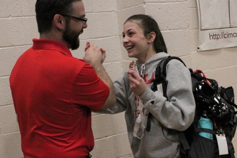 Arbor View’s Peyton Prussin shows off her third-place medal to coach Tyler Sutton, as ...