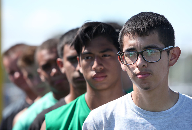 Rancho players Angel Lopez-Caja, right, and Gerson Herrera, center, line up during practice ...